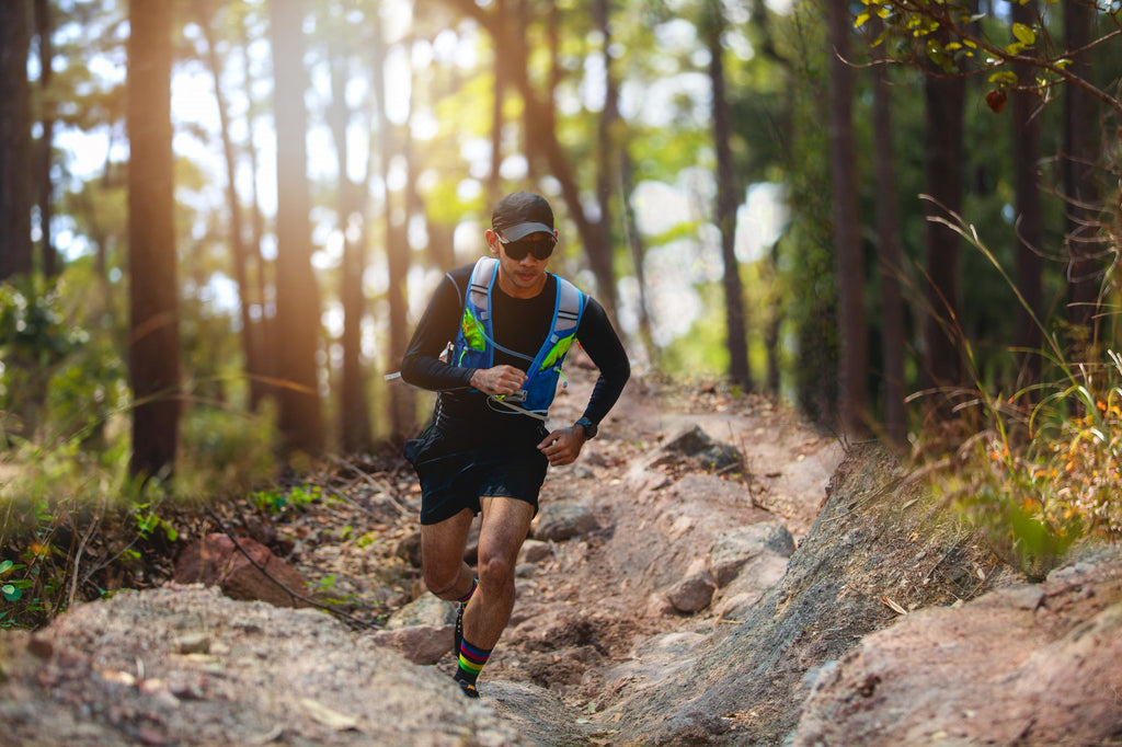 man-runner-trail-athlete-s-feet-wearing-sports-shoes-trail-running-forest
