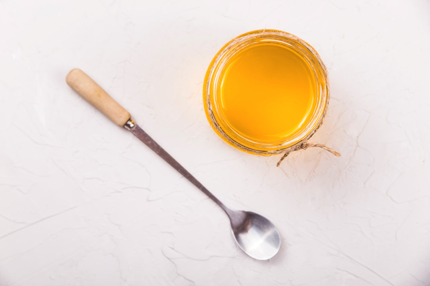 Metal spoon and honey